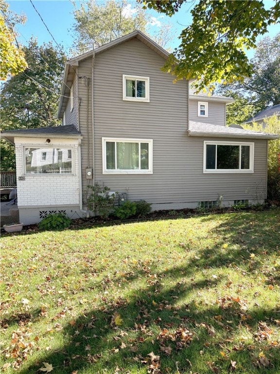 view of home's exterior with a yard