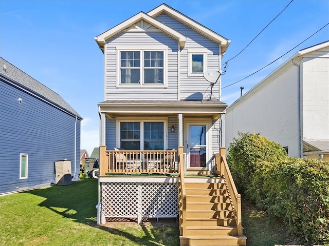 rear view of property with a yard