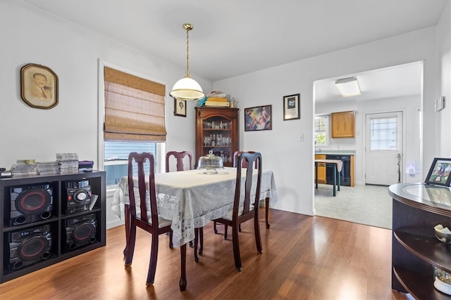 dining space with light hardwood / wood-style flooring