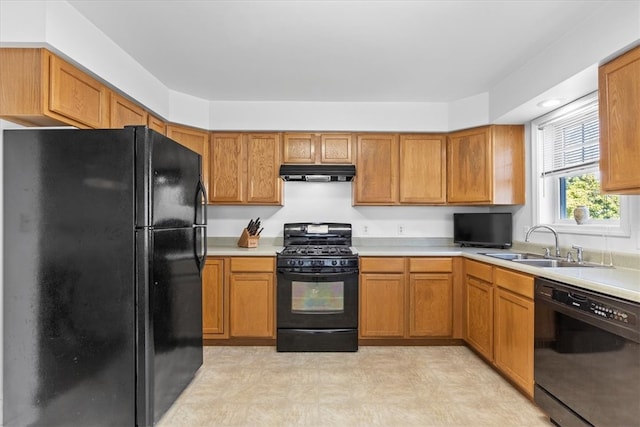 kitchen featuring black appliances and sink