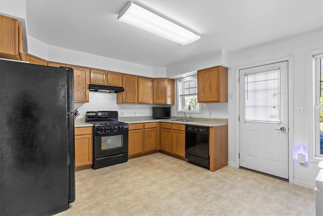 kitchen featuring black appliances and sink