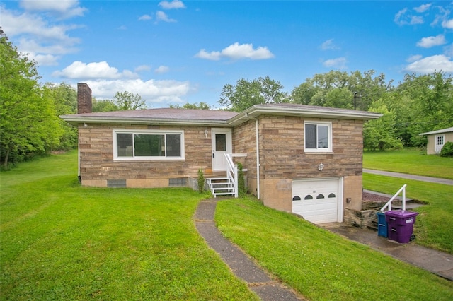 view of front of house featuring a garage and a front lawn