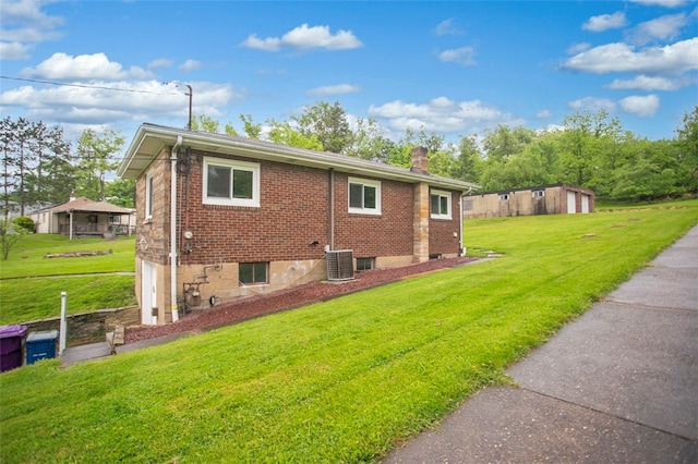 view of property exterior with cooling unit and a yard