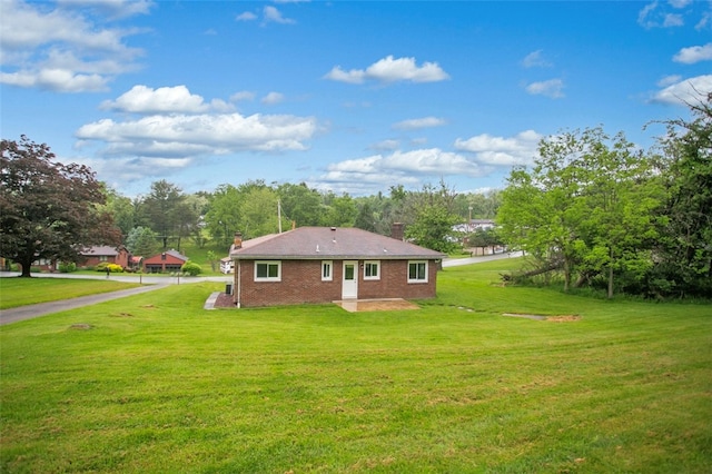 view of home's exterior featuring a yard