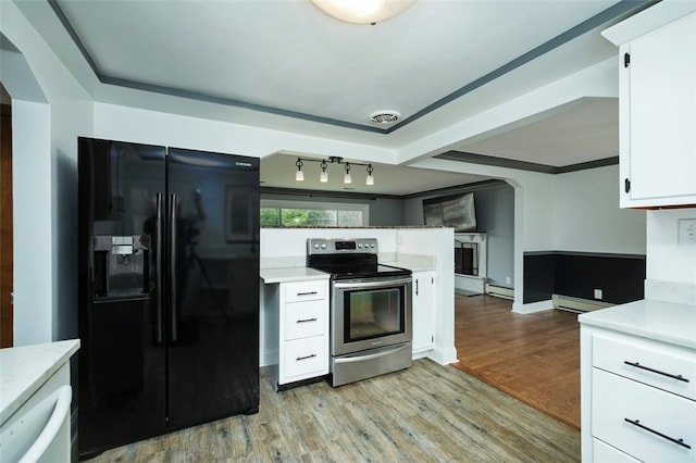 kitchen with black refrigerator with ice dispenser, light hardwood / wood-style floors, stainless steel electric range oven, and white cabinetry