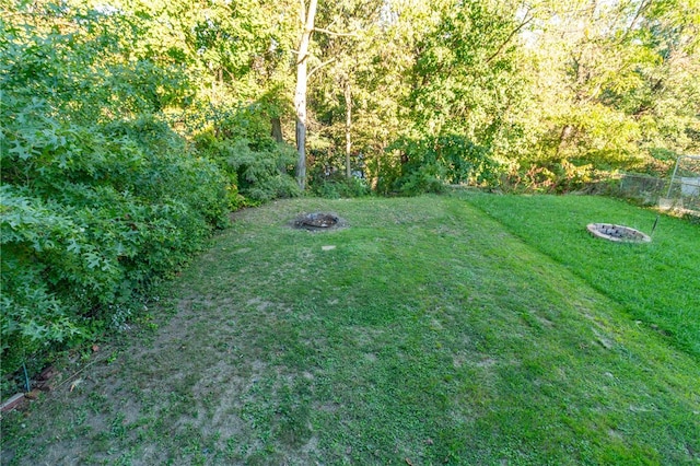 view of yard with an outdoor fire pit