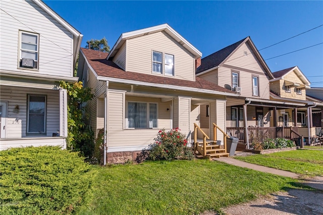 view of front of home featuring a front yard and covered porch