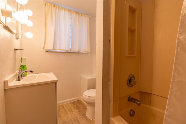 full bathroom with toilet, shower / bathtub combination with curtain, a notable chandelier, hardwood / wood-style flooring, and vanity