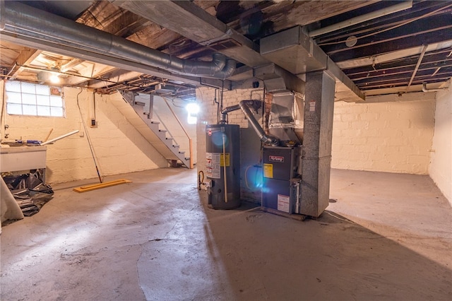 basement featuring gas water heater, sink, and heating unit