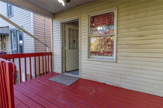 view of exterior entry with a deck