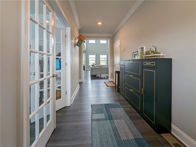 hallway featuring crown molding and dark hardwood / wood-style flooring