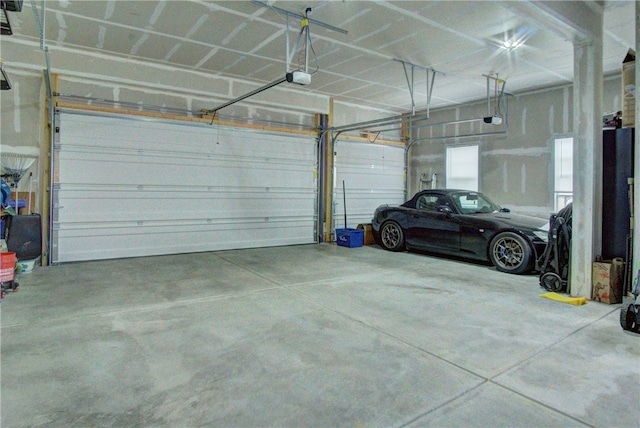 garage featuring a garage door opener