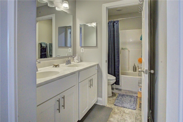 full bathroom featuring vanity, tile patterned floors, toilet, and shower / bath combo