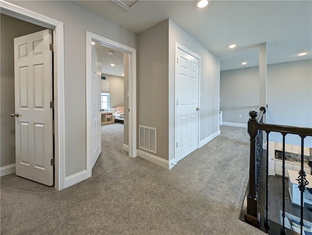 hallway with carpet flooring