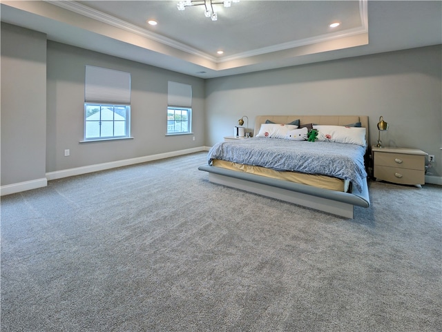 bedroom featuring carpet floors, a raised ceiling, and ornamental molding