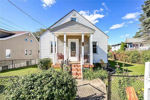 bungalow-style house featuring a front lawn