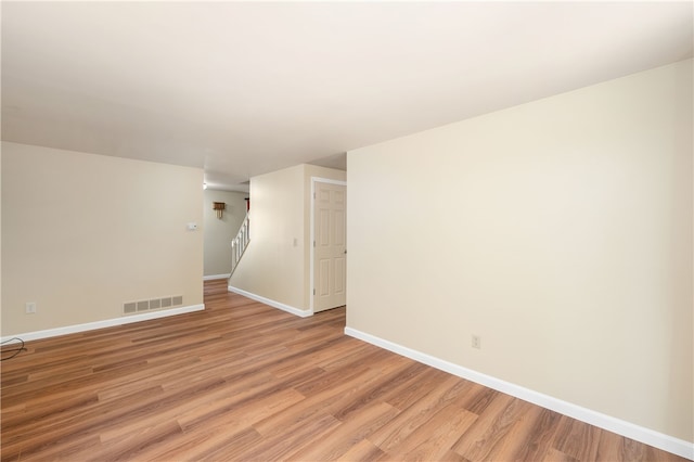 spare room featuring light hardwood / wood-style flooring