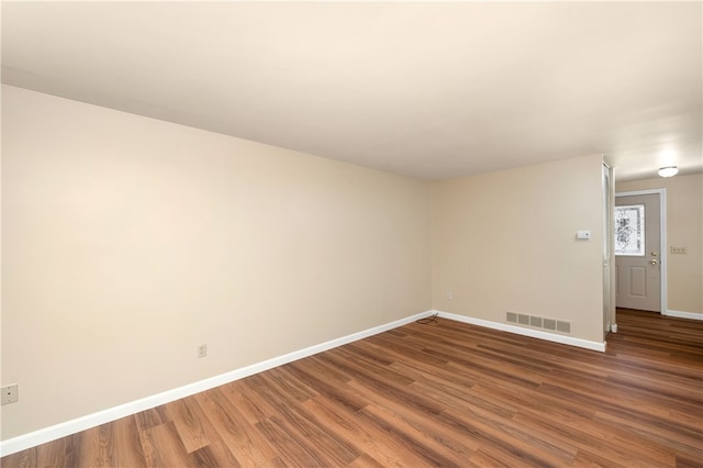 empty room featuring wood-type flooring