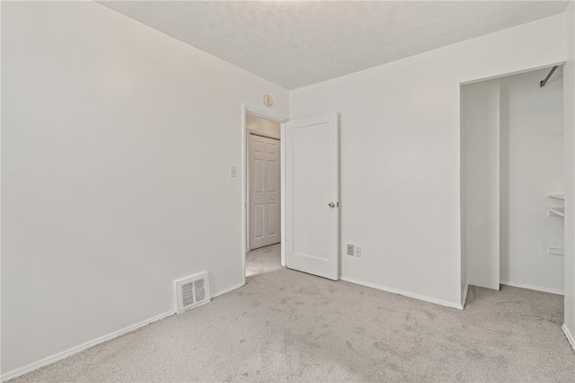 unfurnished bedroom with light carpet