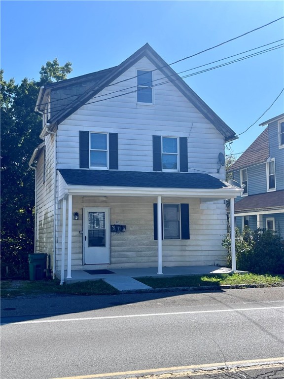 front of property featuring covered porch