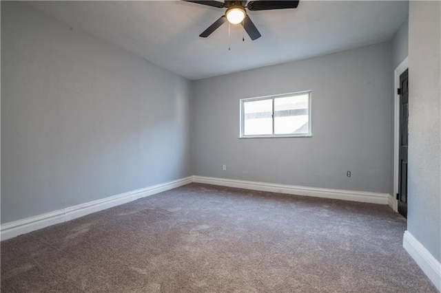 carpeted empty room featuring ceiling fan