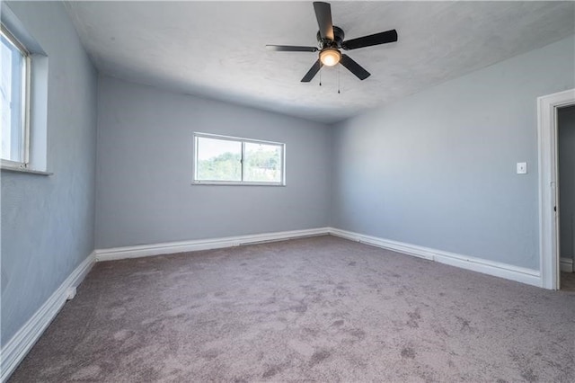 carpeted empty room with ceiling fan