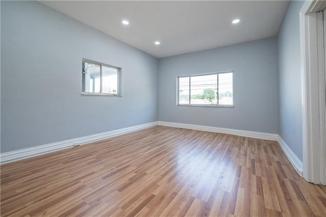 unfurnished room with light wood-type flooring