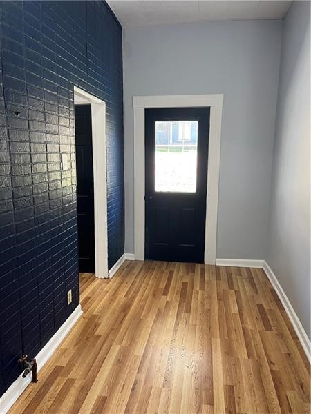 entryway with hardwood / wood-style flooring