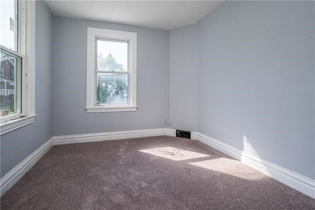 unfurnished room with carpet floors