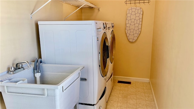 laundry room with separate washer and dryer