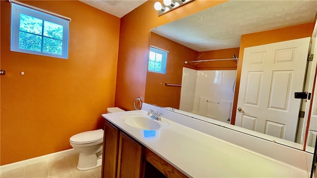 bathroom with tile patterned flooring, a shower, toilet, vanity, and a textured ceiling