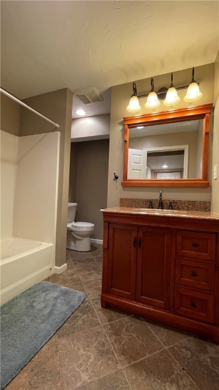 full bathroom featuring tile patterned flooring, bathtub / shower combination, vanity, and toilet