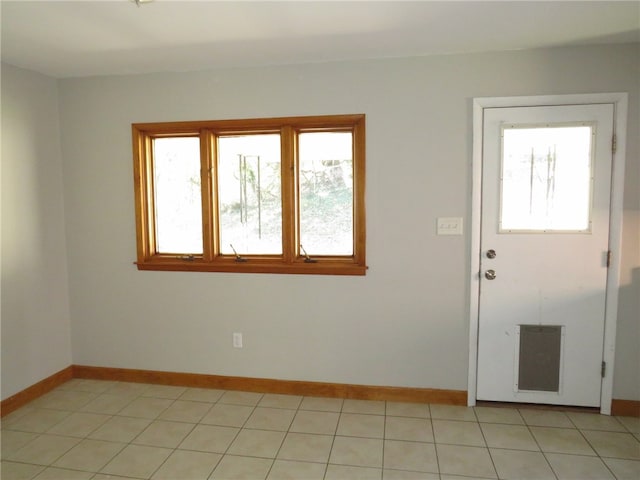 entryway with light tile patterned floors