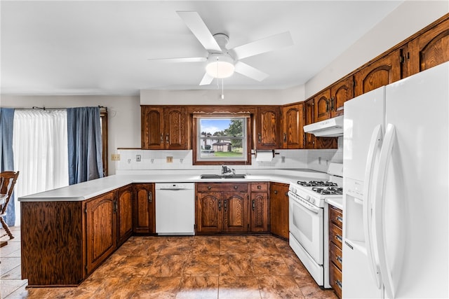 kitchen with white appliances, backsplash, sink, and ceiling fan