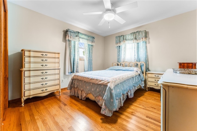 bedroom featuring light wood-type flooring and ceiling fan