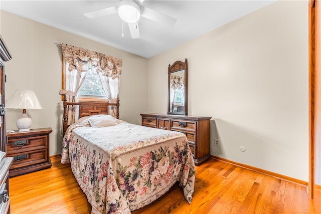 bedroom with light hardwood / wood-style flooring and ceiling fan