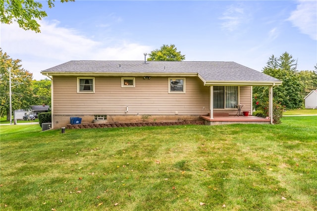 back of property featuring a lawn and a patio area