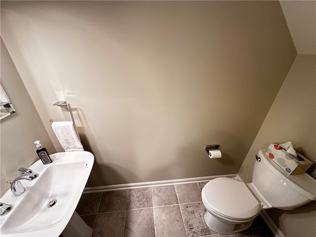 bathroom featuring tile patterned floors, sink, and toilet