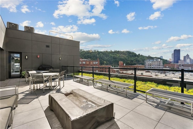 view of patio featuring a view of city and an outdoor hangout area