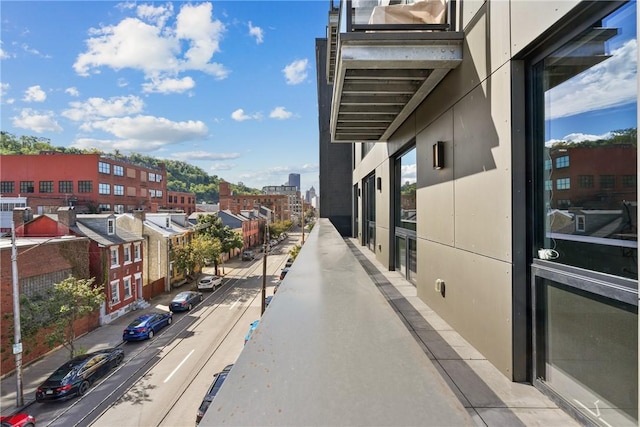 view of road with a view of city, curbs, and sidewalks