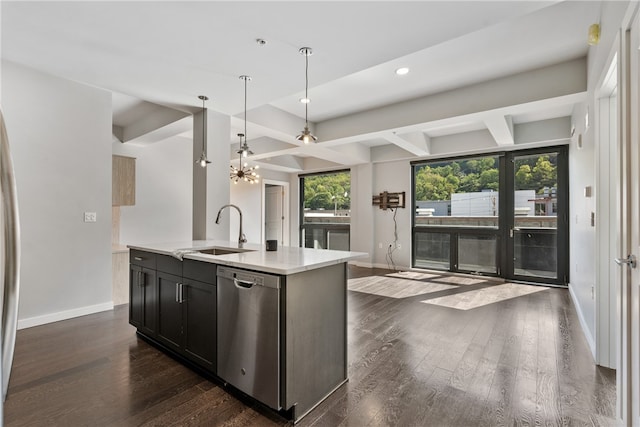 kitchen featuring plenty of natural light, an island with sink, sink, and stainless steel dishwasher