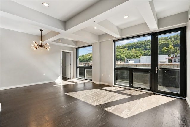 interior space with dark hardwood / wood-style floors, beamed ceiling, a notable chandelier, and a wealth of natural light