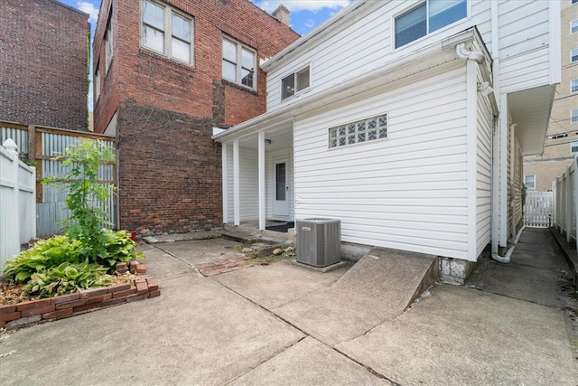 back of house featuring central air condition unit and a patio