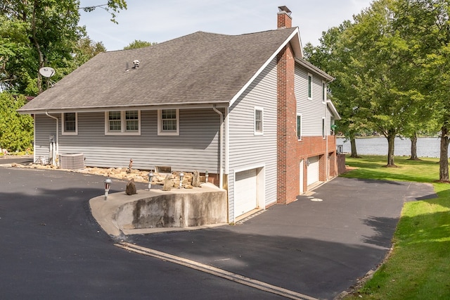 view of side of home with a garage