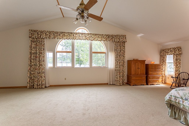 bedroom with ceiling fan, light colored carpet, and lofted ceiling