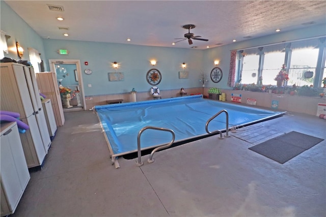 view of swimming pool featuring pool table and ceiling fan