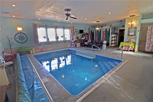 view of swimming pool featuring ceiling fan