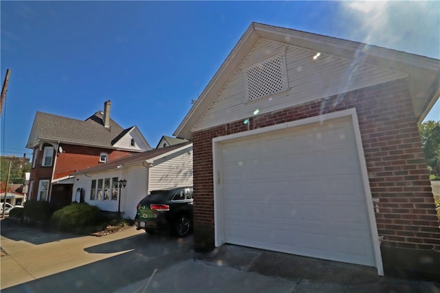 view of side of property featuring a garage