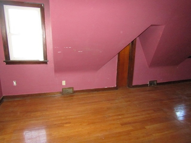 bonus room featuring hardwood / wood-style floors