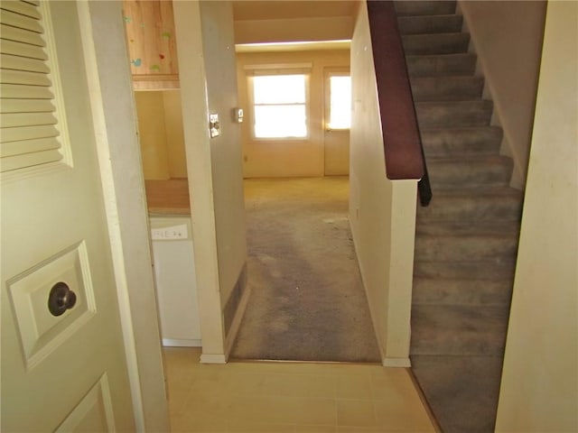 hallway featuring stairs